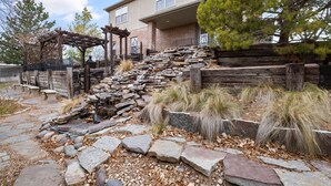 A stone pathway leading to a wooden pergola and a staircase with a wooden railing. - The West Nest 2 -Families, 2 Kings, Game Room (Canyon)