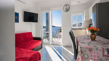 Apartment (One Bedroom Apartment with Balcony) | Living room | TV