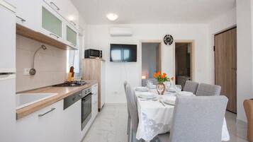 Apartment (Two Bedroom Apartment with Balcony) | Private kitchen | Fridge, coffee/tea maker, electric kettle