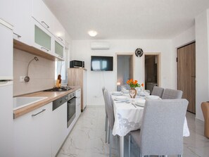 Apartment (Two Bedroom Apartment with Balcony) | Private kitchen | Fridge, coffee/tea maker, electric kettle
