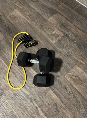 Guests can work out with dumbbells in the fitness area.
