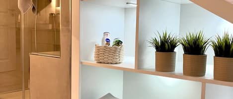 Shower, hair dryer, towels, soap