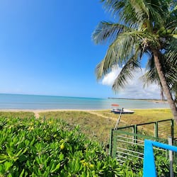 On the beach, white sand, beach umbrellas, beach towels