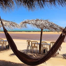 On the beach, white sand, beach umbrellas, beach towels