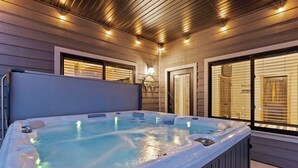 A hot tub with a wooden deck and a ceiling with recessed lighting. - Luxury Lodge w/ Hot Tub + Boat Slip | 2 Min to Silver Dollar City! (Branson)