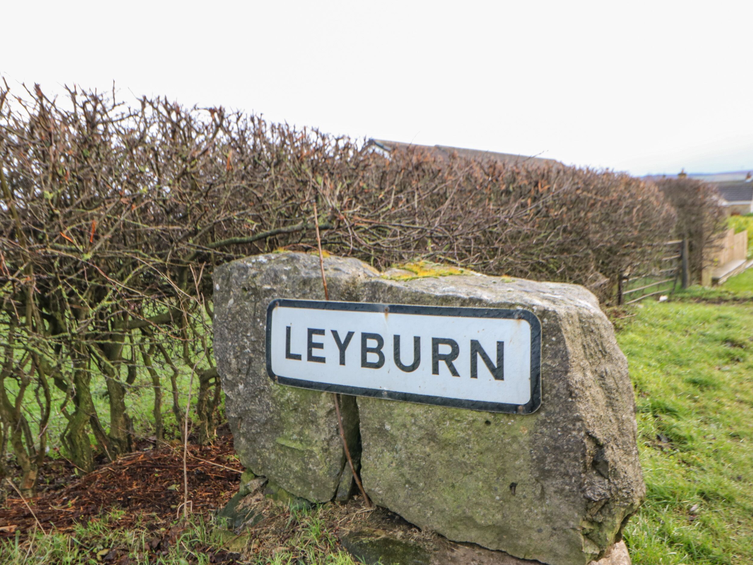A stone sign with the name "LEYBURN" on it.