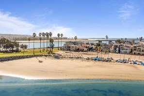 A coastal hotel with multiple buildings, a sandy beach, and a clear view of the ocean. - Bayfront w/ Large Private Patio | AC | Pet Friendly (San Diego)