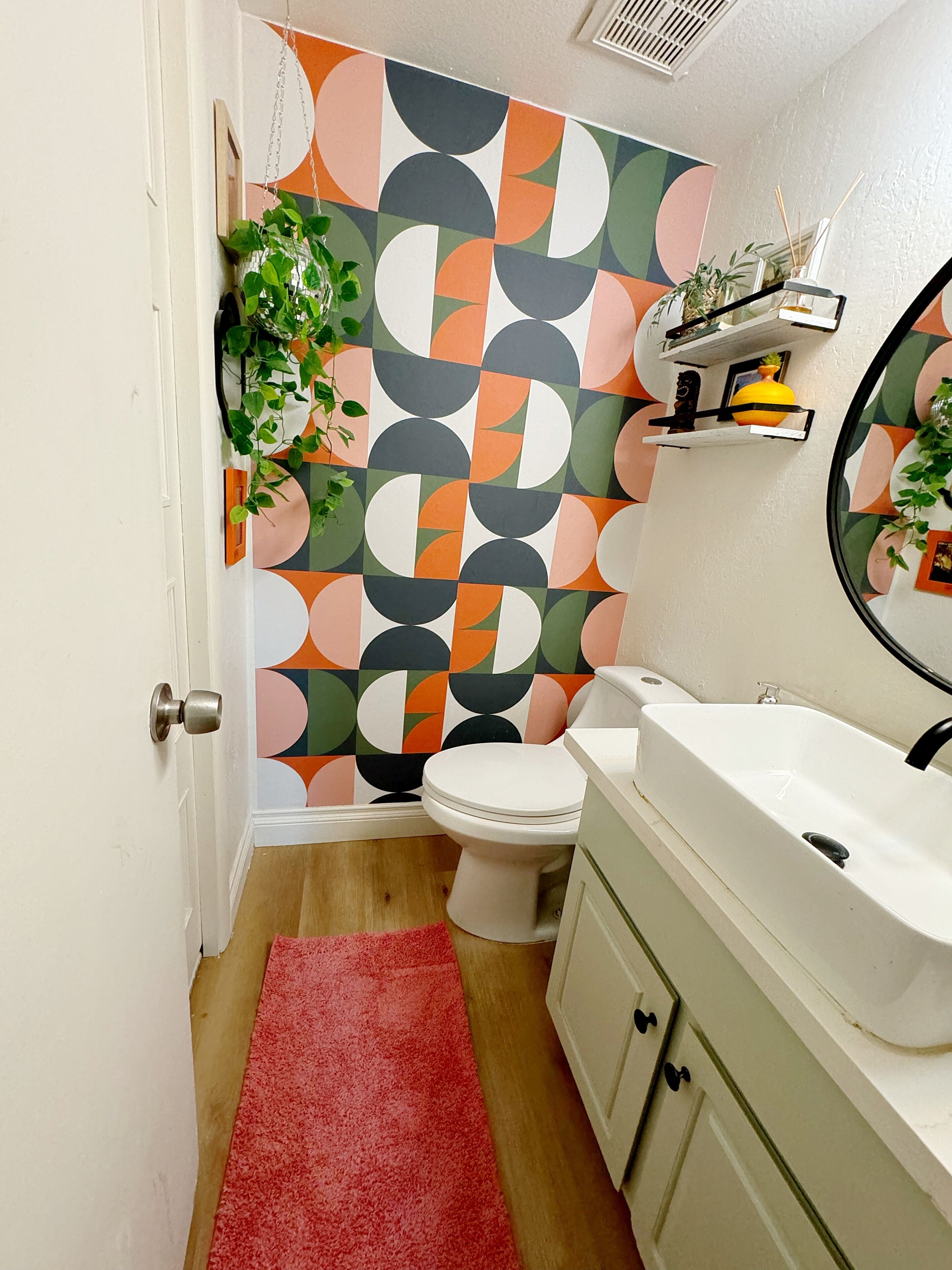 powder room off kitchen, with storage closet