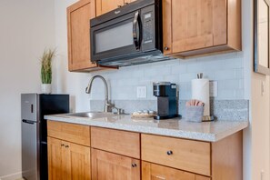 Microwave, coffee/tea maker, toaster, cookware/dishes/utensils