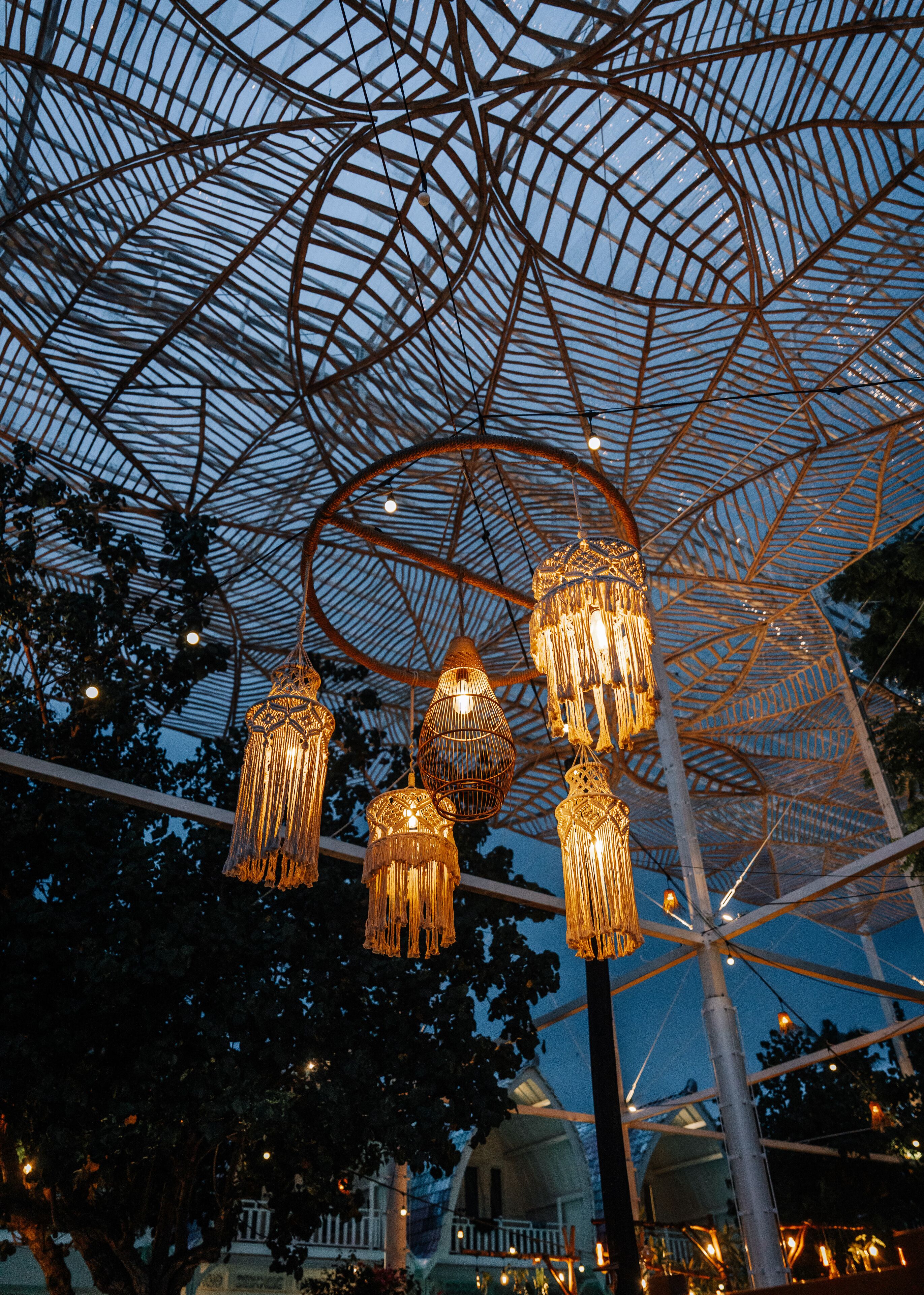 A large, open structure with a complex metal framework and hanging lights.