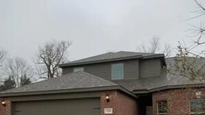 A two-story house with a garage, brick exterior, and a small front yard with dry grass. - Beautiful, Large 4 bedroom Home in Anna Tx (Anna)