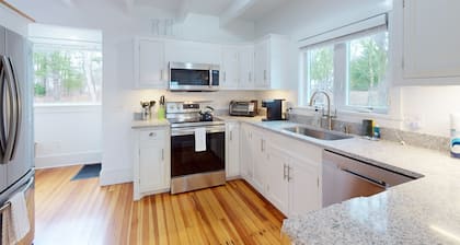 Inviting home + apartment near beach with furnished deck, yard, & grill