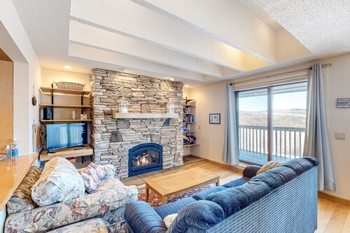 Picturesque mountain view condo with fireplace, balcony, deck, pool, & kitchen
