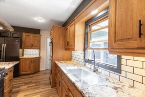 Fridge, microwave, oven, stovetop - Spacious 3BR home overlooking Boom Lake, Hodag Park, and Rhinelander amenities (Rhinelander)