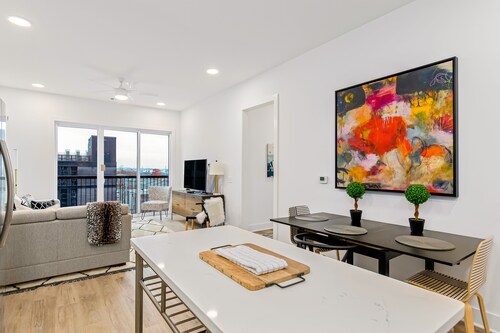 Centrally located condo with central AC, shared rooftop terrace, and city views