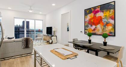 Centrally located condo with central AC, shared rooftop terrace, and city views