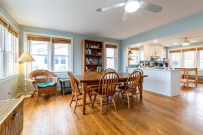 Spacious dining room located between the kitchen and family room