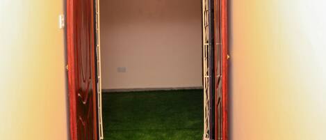 A reception area with a red carpet leading to a door marked "RECEPTION."