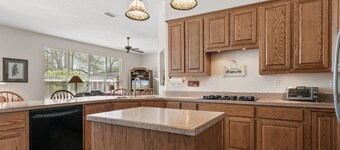 Relax in our cozy 3 BR home with a spacious master suite with soaking tub, large yard, pool, BBQ