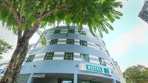 A multi-story hotel with a modern design, featuring a prominent "HOTEL 81" sign. - Hotel 81 Lavender (Singapore)