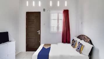 Desk, laptop workspace, bed sheets