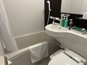 Combined shower/tub, free toiletries, hair dryer, slippers