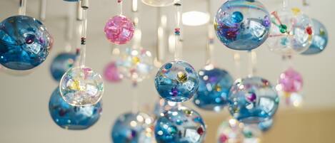 A collection of hanging glass orbs with various colors and patterns.