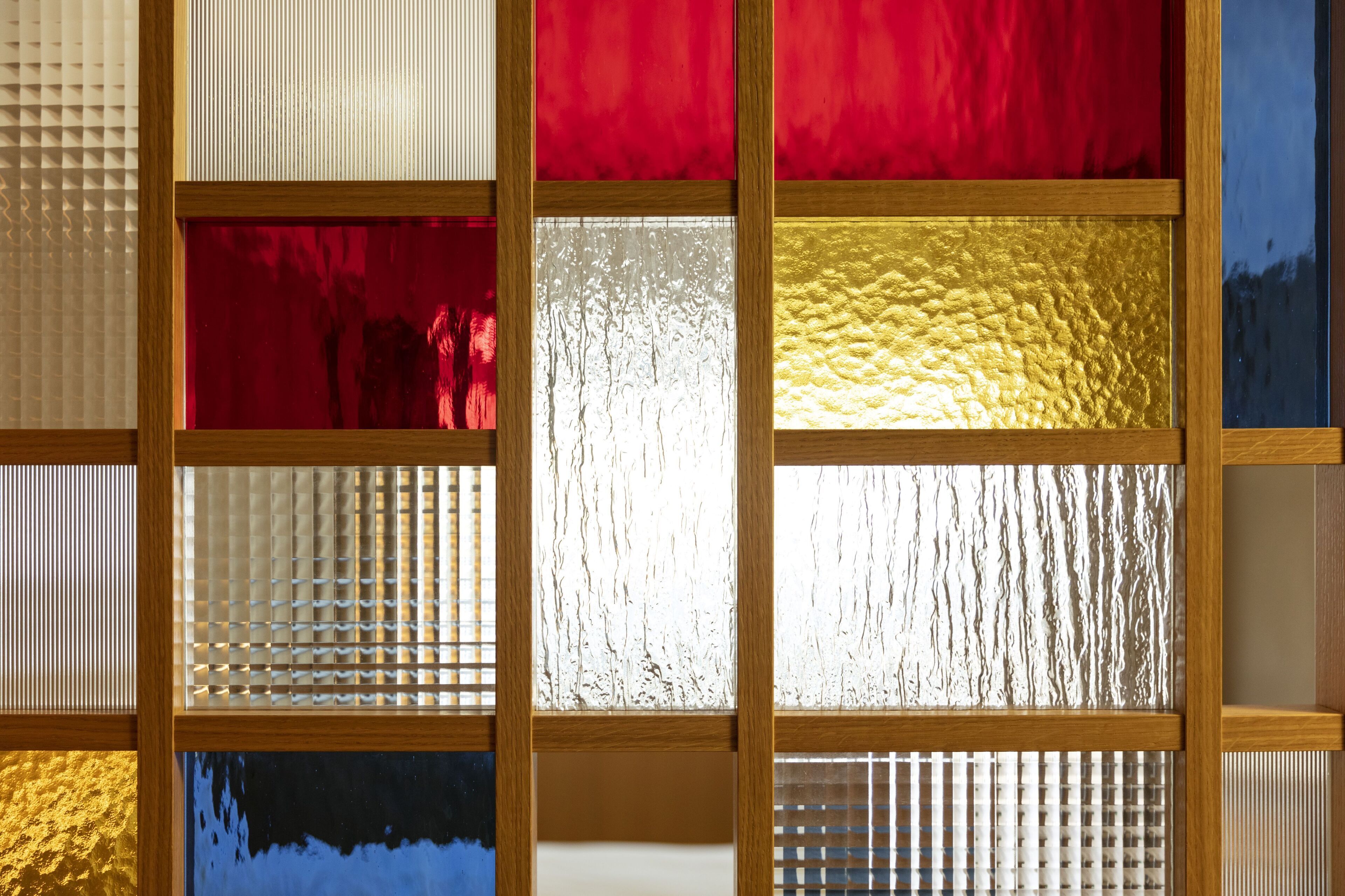 A stained glass window with multiple panels in various colors.