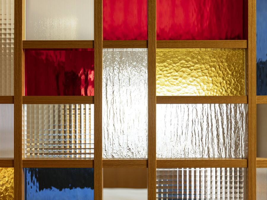 A stained glass window with multiple panels in various colors.