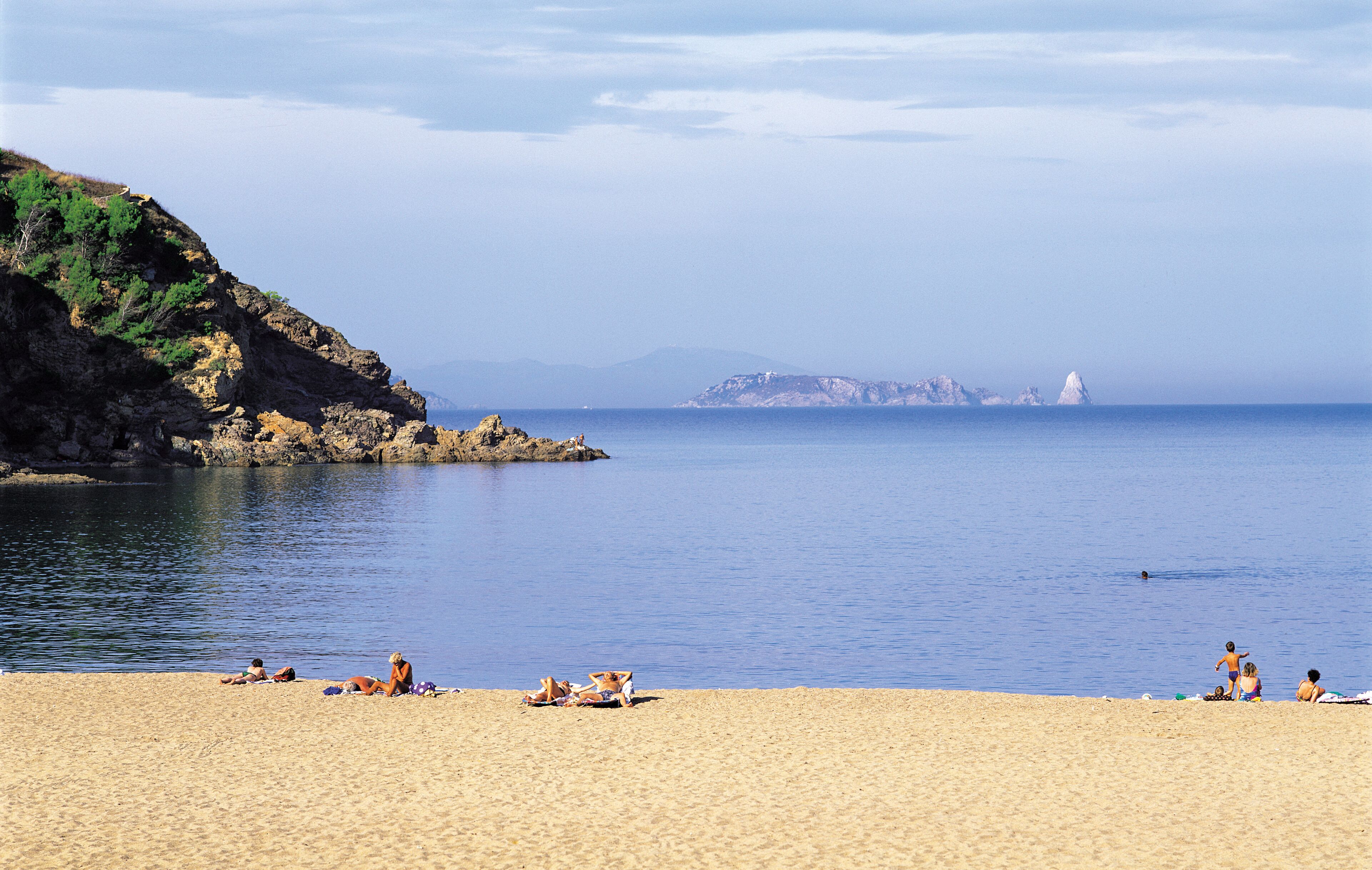 On the beach, sun-loungers