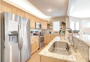 Dishwasher, coffee/tea maker, cookware/dishes/utensils, dining tables