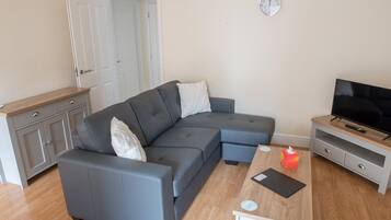 City Apartment | Living area | 32-inch Smart TV with digital channels, TV