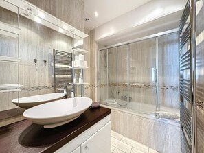 Shower, eco-friendly toiletries, hair dryer, towels