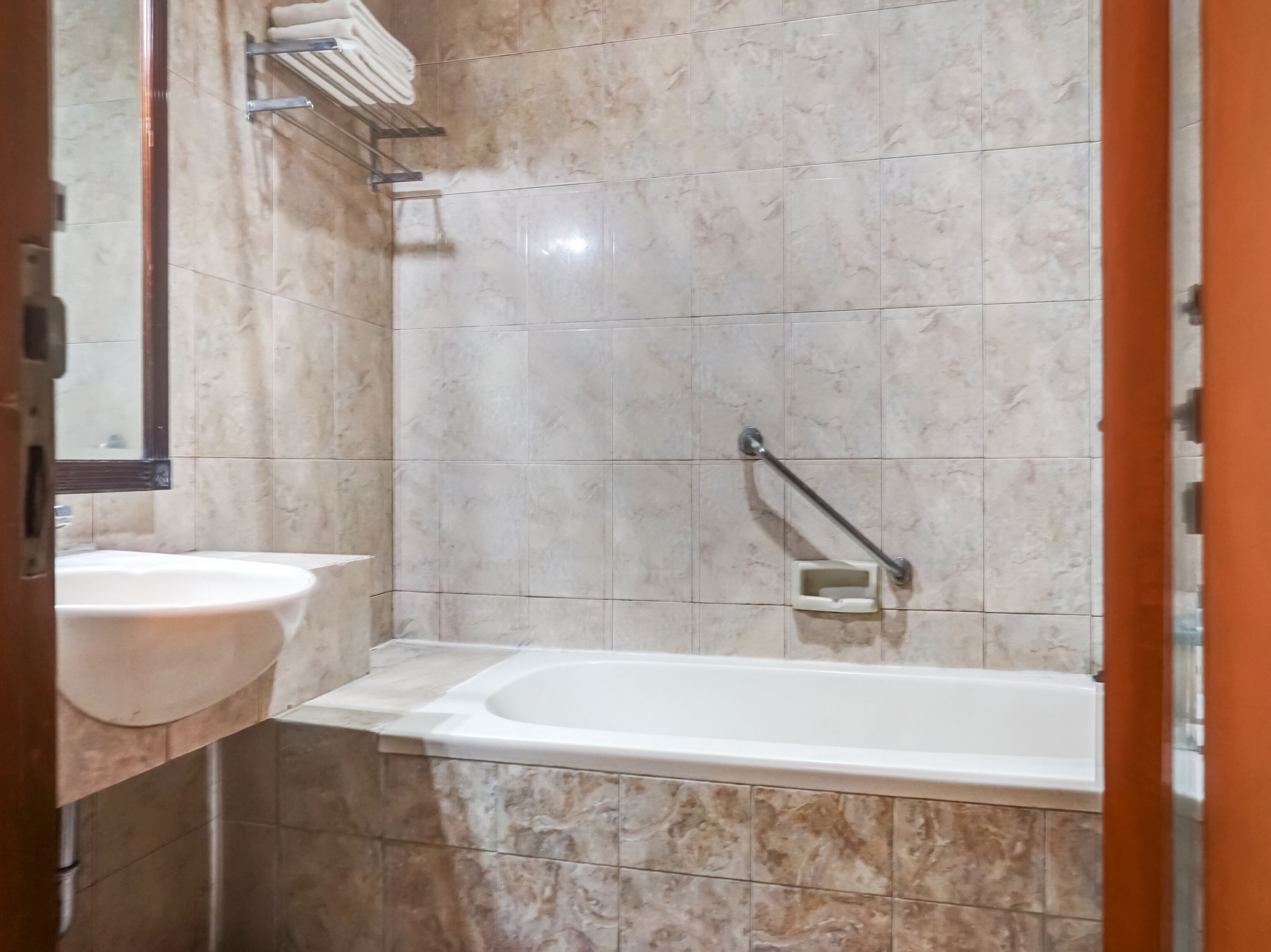 deluxe double room | bathroom | shower, towels, toilet paper
