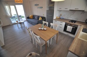 Departamento Confort | Área de sala de estar | Televisión LED