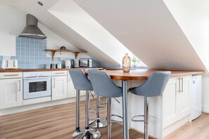 Apartment | Private kitchen | Fridge, cleaning supplies, dining tables