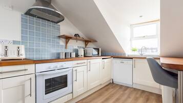 Apartment | Private kitchen | Fridge, cleaning supplies, dining tables