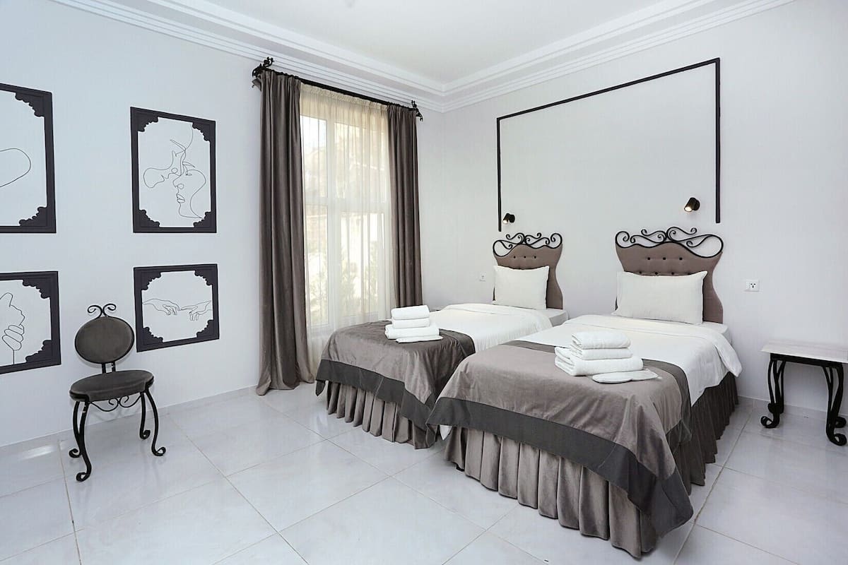 Family Room, Garden Area | Premium bedding, in-room safe, desk, free WiFi