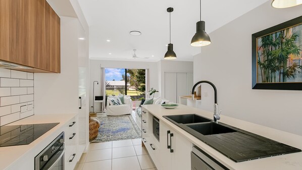 Fridge, microwave, stovetop, dishwasher - The Villa at Fraser Cove - Modern Northern Rivers Villa - Pet Friendly - Min. 3 Night Stays! (Tweed Heads South)