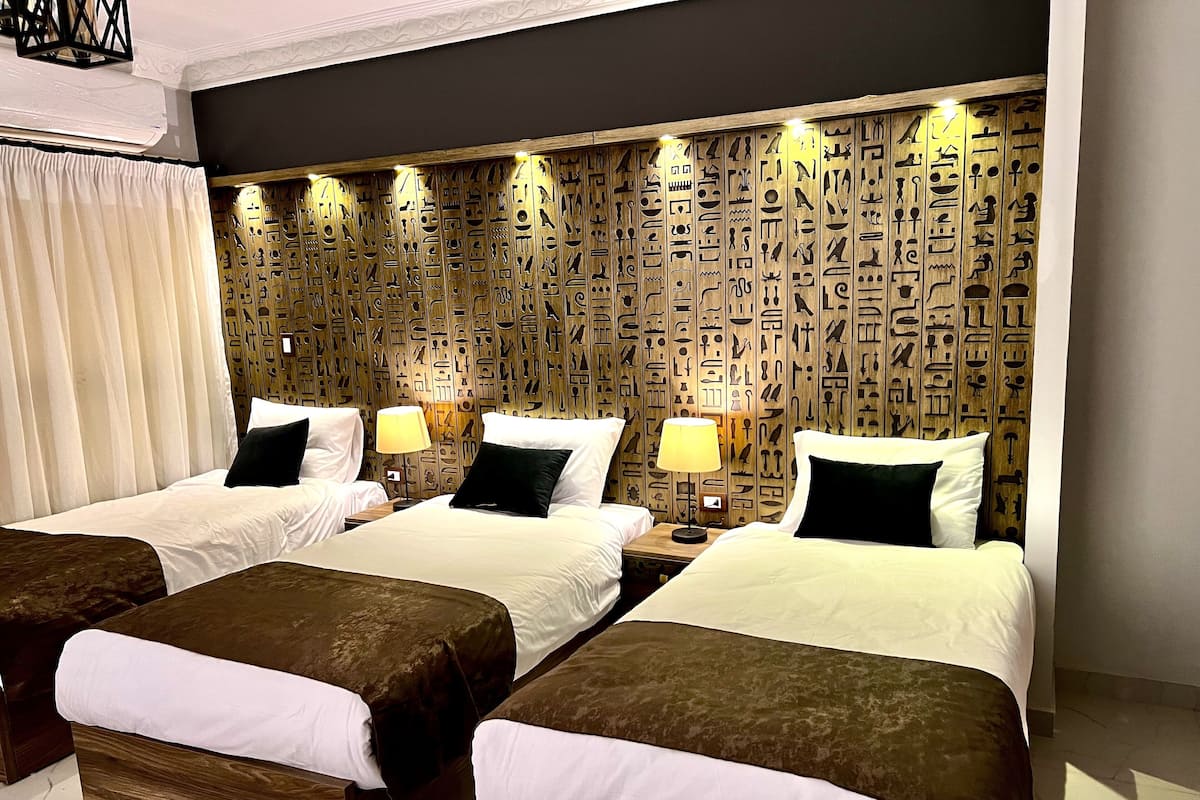 Grand Triple Room | 1 bedroom, individually decorated, individually furnished, desk