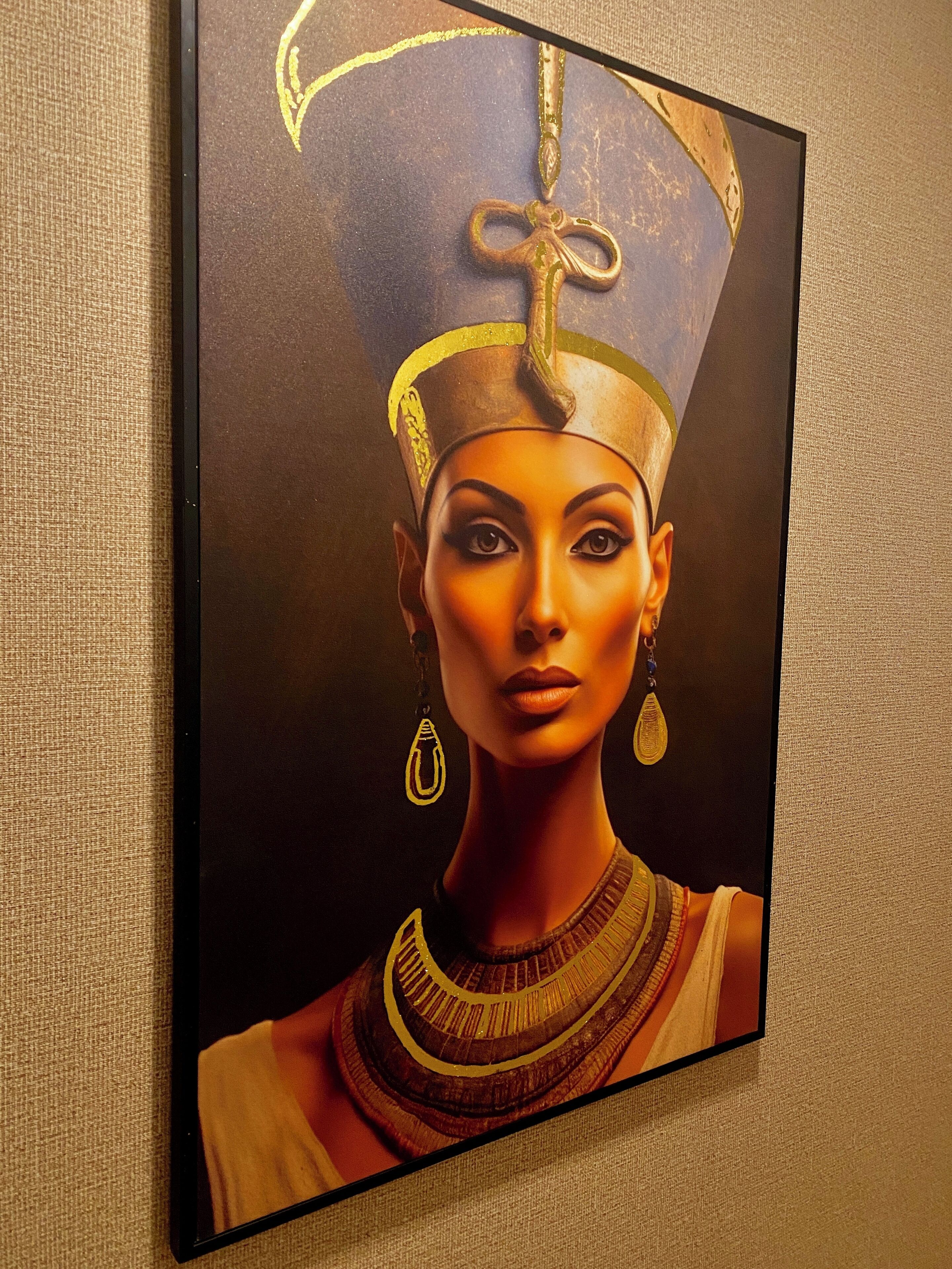 A framed artwork depicting a figure in traditional attire with a headdress and jewelry.