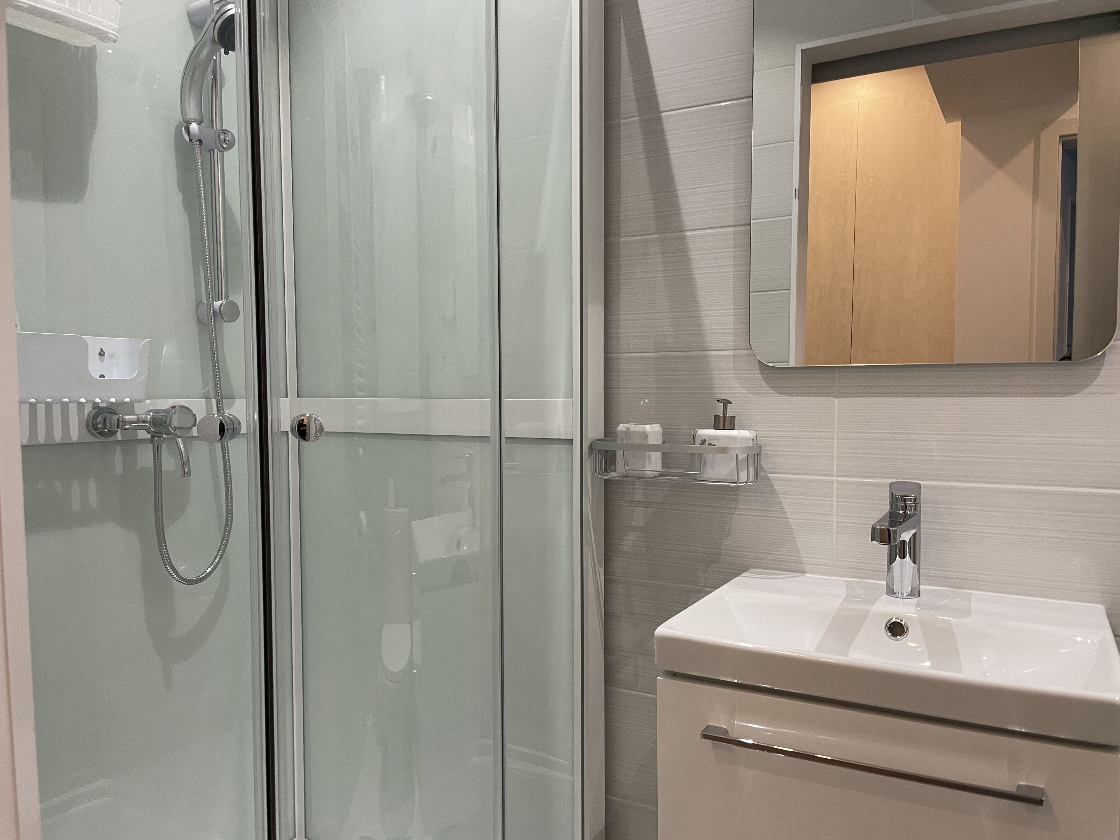 Shower, hair dryer, towels, soap
