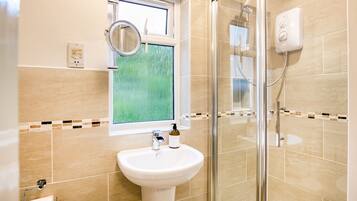 Shower, hair dryer, towels, soap