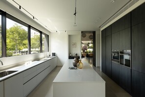 Luxury Villa | Private kitchen | Full-size fridge, microwave, oven, stovetop