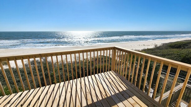A wooden deck with a view of the ocean and beach. - Beachfront - Community Pool/Pickleball Access! (St. George Island)