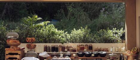 A breakfast buffet with various food items and condiments.