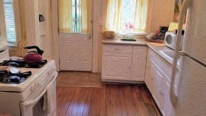 A compact kitchen with a gas stove, a sink, and a window with curtains. - Barkley-Hayward Cottage (Little Rock)