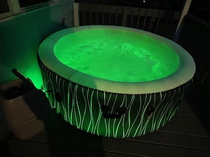 A hot tub with a green light.