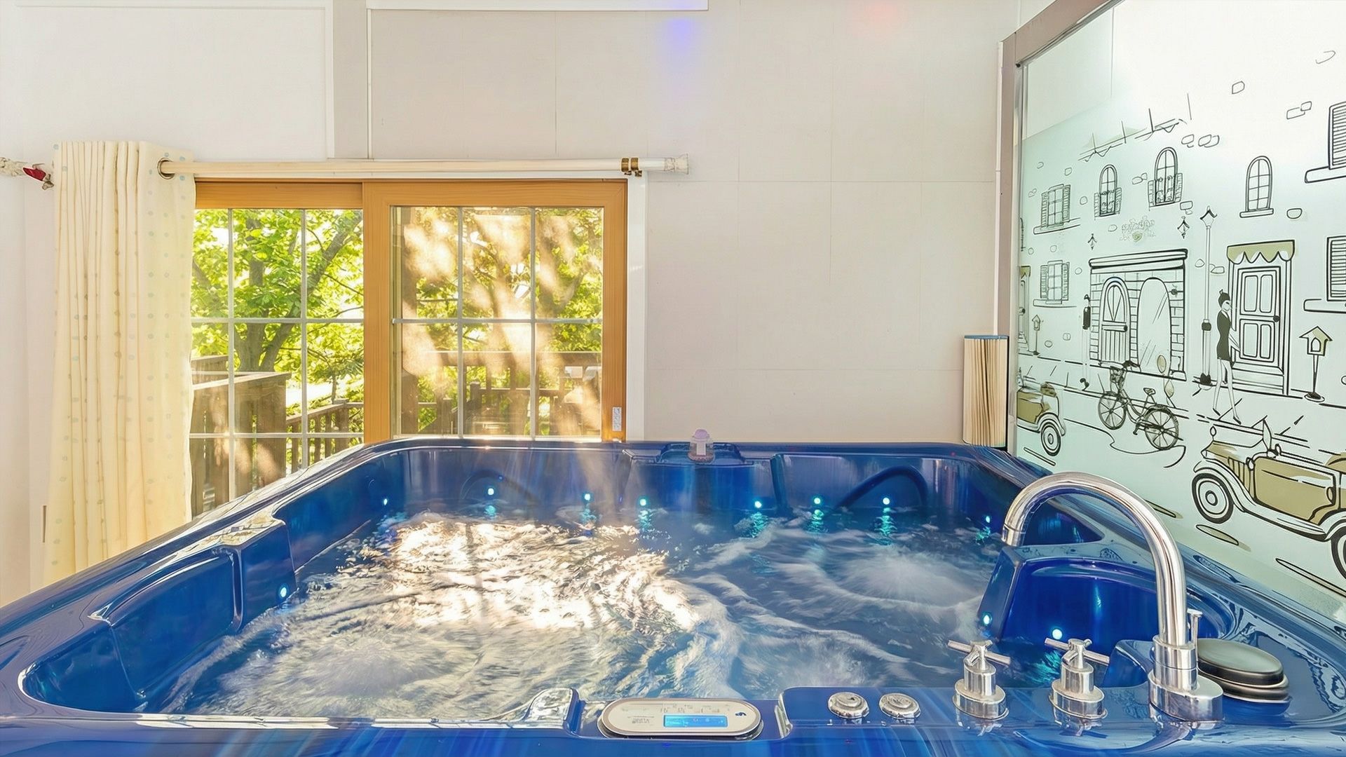 A hot tub with a digital control panel, a window with curtains, and a wall with a vintage car illustration.