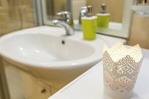 A bathroom sink with a mirror above it.